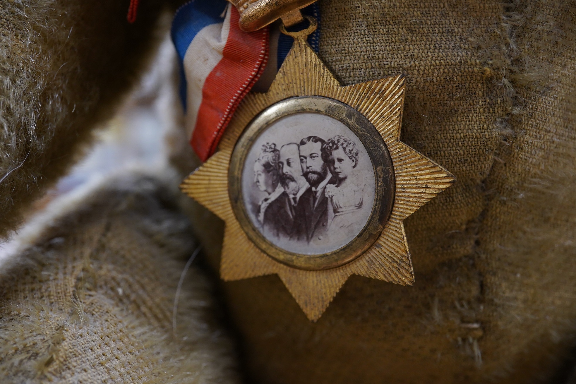 An early German bear wearing medal commemorating Queen Victoria's Jubilee, hair loss and general wear and staining to mohair, c.1912, 48cm high